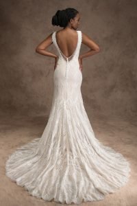 Back of bride wearing an ivory art deco wedding dress with a back opening with buttons