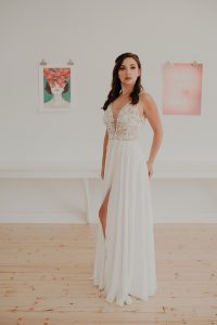 A-Line wedding gown with slit light skirt deep v woman in wedding dress