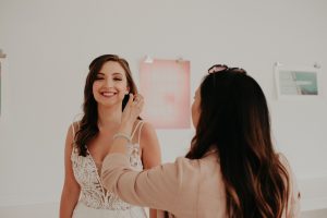 Finishing touches on wedding dress shoot