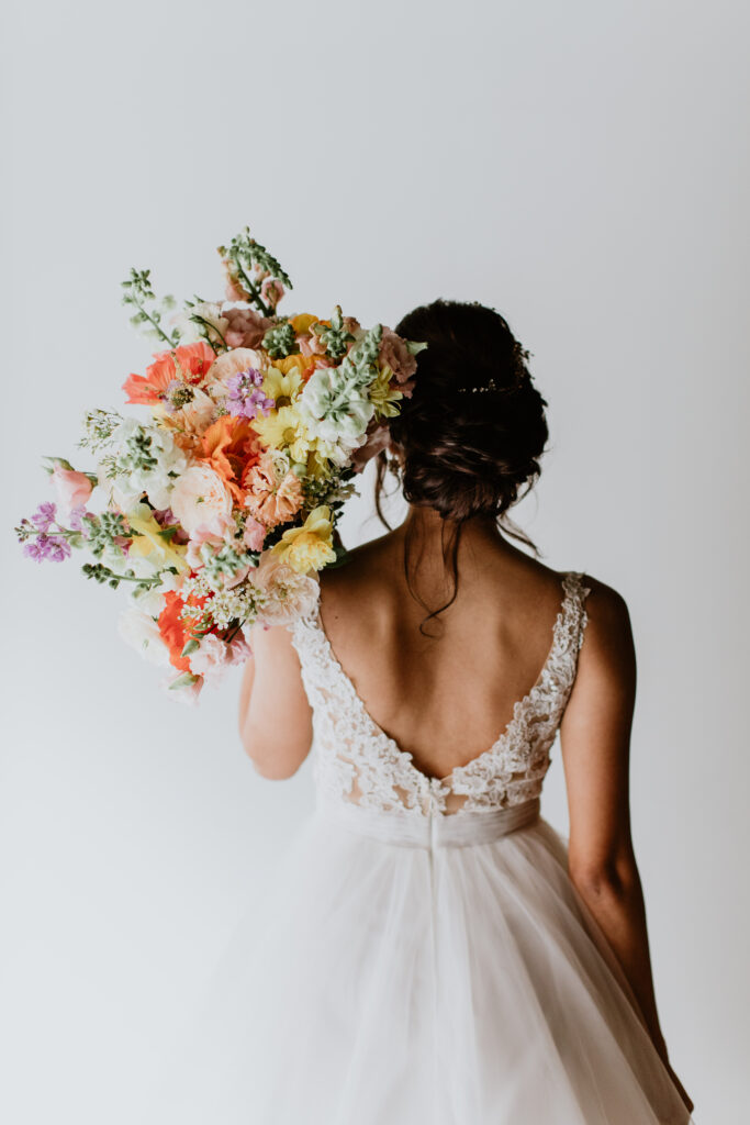 bride in romantic ballgown low back bridal style