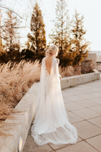 pearl bridal cape with open back dress goddess wedding dress look golden hour bride