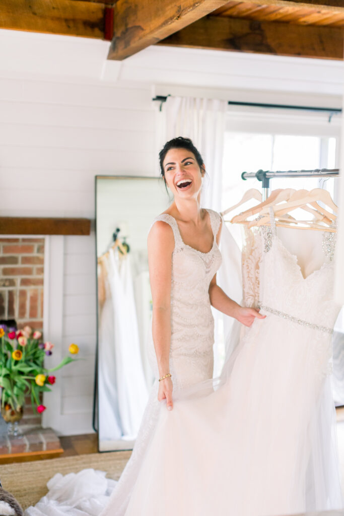 woman trying on wedding dress at home