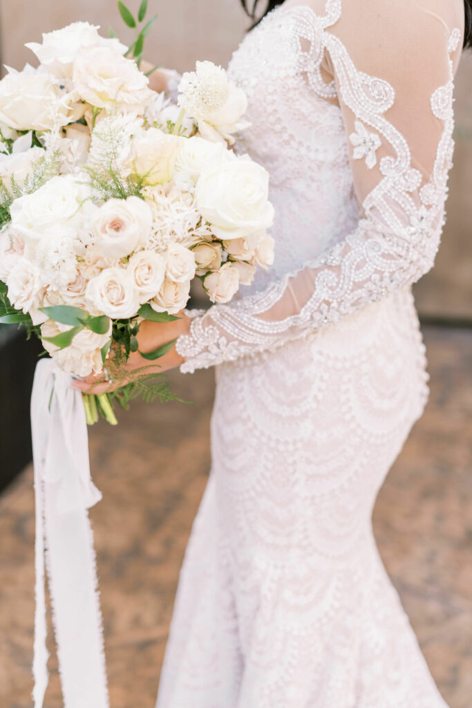 fitted lace wedding gown with beaded sleeves