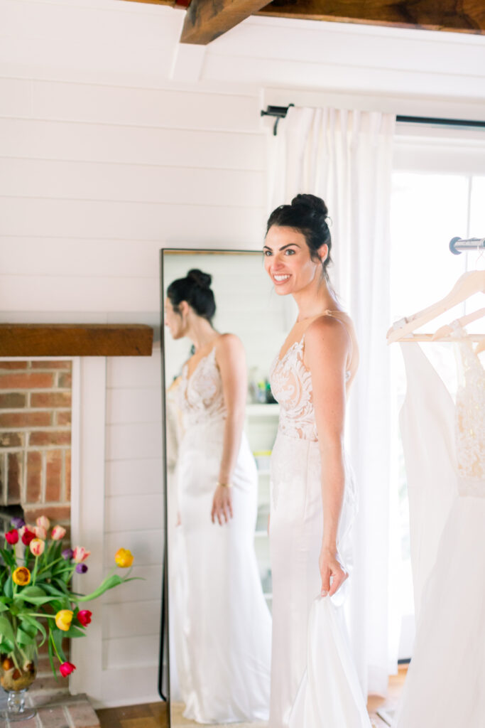 bride in wedding dress fitting