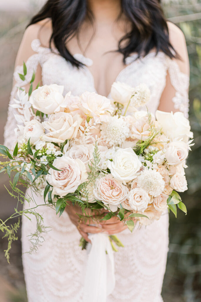 bridal bouquet blush white long sleeve wedding dress