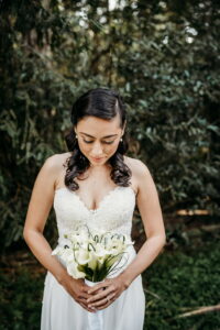 Grace + Ivory bride with ivory sweetheart strapless neckline and flowers