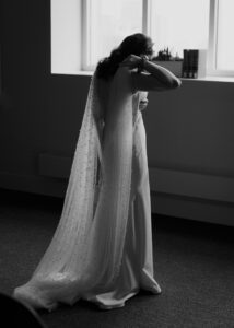 bride in pearl tulle cape