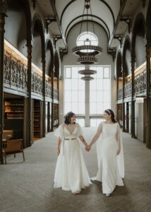 two brides in library wedding venue