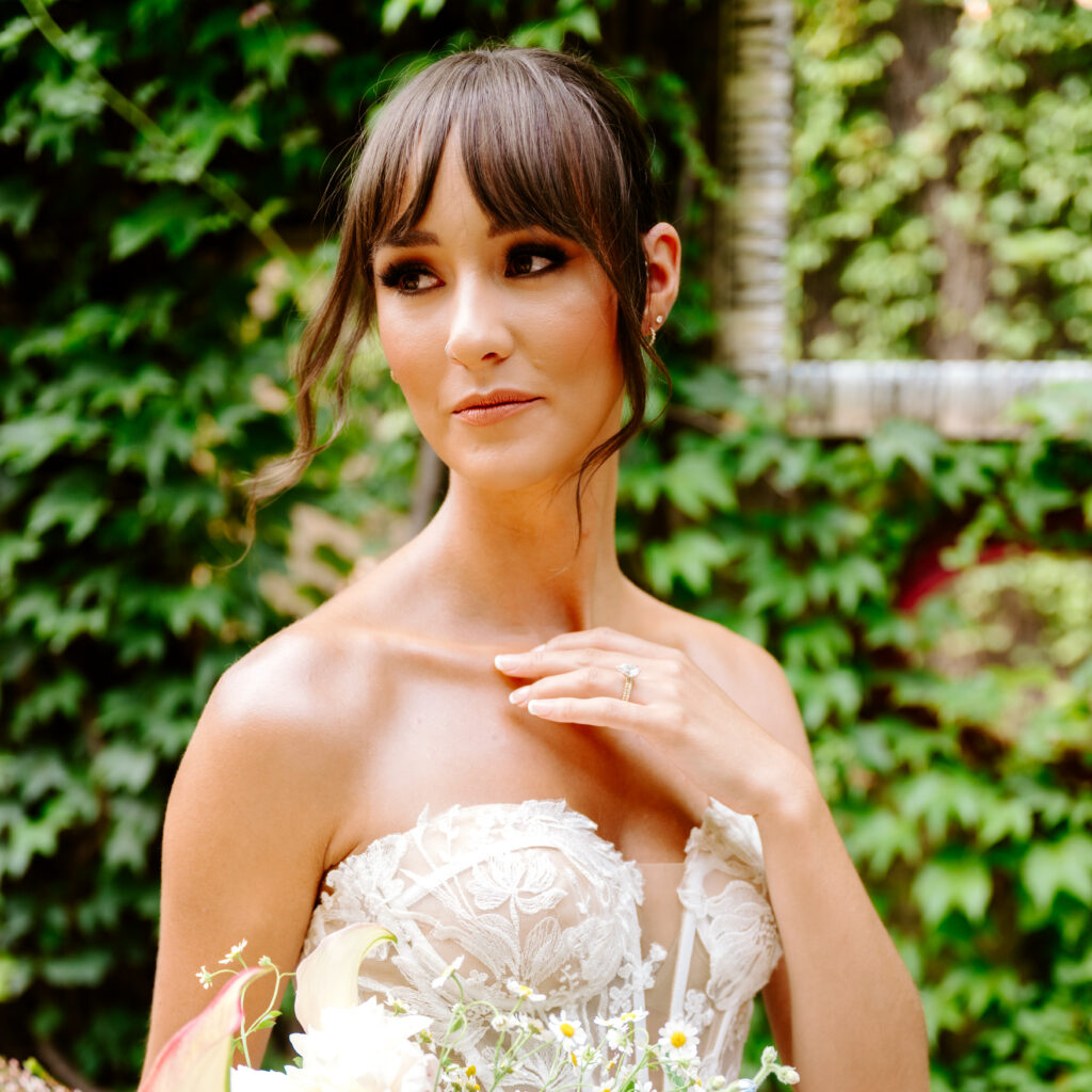 bridal makeup ideas bride with bun and bangs and soft glam makeup